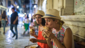 save money on food when travelling tourists gyros