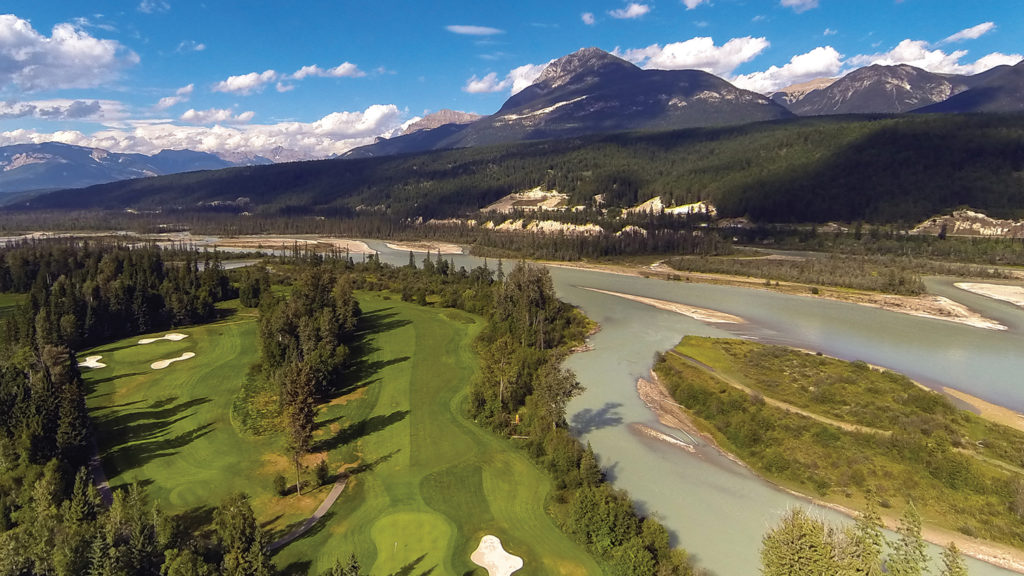 Overhead photo of Golden golf course with river running alongside and mountains in background